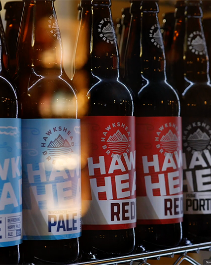 A range of Hakshead Brewery beers in a fridge. This is a still from a presenter-led brewery tour video filmed at Hawkshead Brewery in the Lake District.