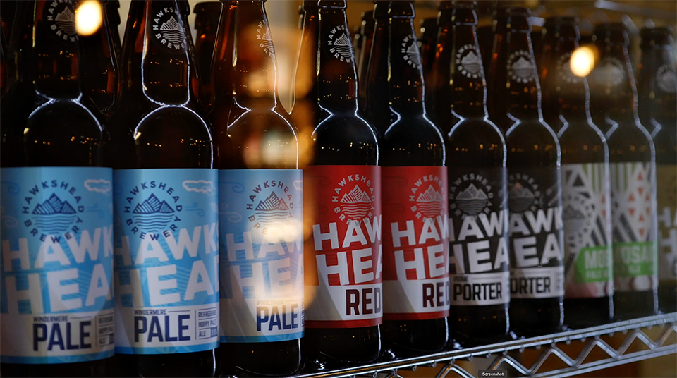 A range of Hakshead Brewery beers in a fridge. This is a still from a presenter-led brewery tour video filmed at Hawkshead Brewery in the Lake District.