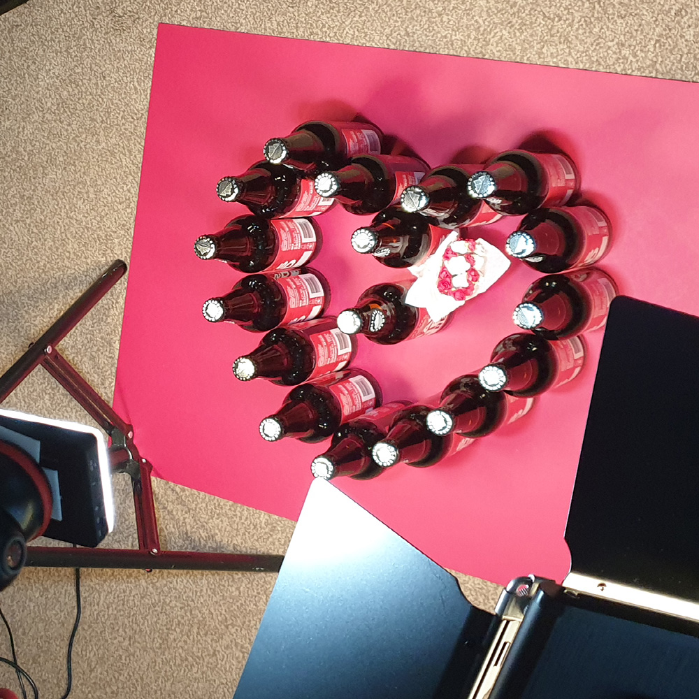 A group of bottles create a heart shape in a scene from a stop motion promotional video filmed in Southport.