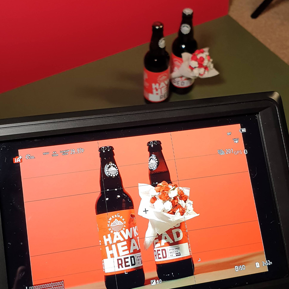 A look through the monitor of a video company filming stop motion content.