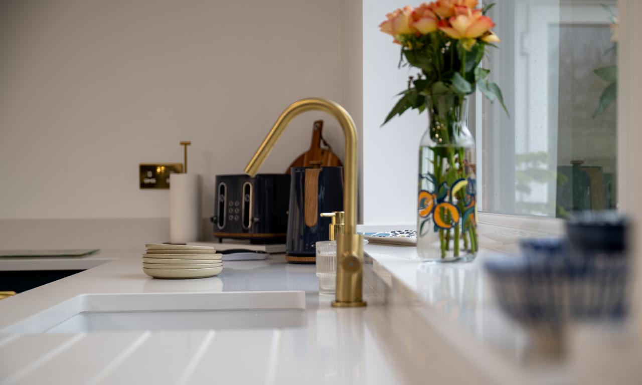 Modern fitted kitchen with island unit photographed for Thomas Howie Kitchens and Bedrooms in Southport.