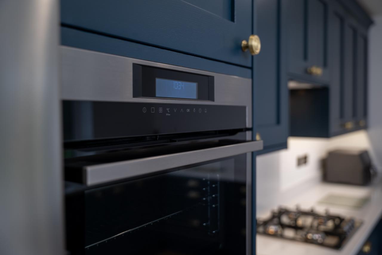 Close-up photography of kitchen appliances, cabinetry and worktop details in Southport home.