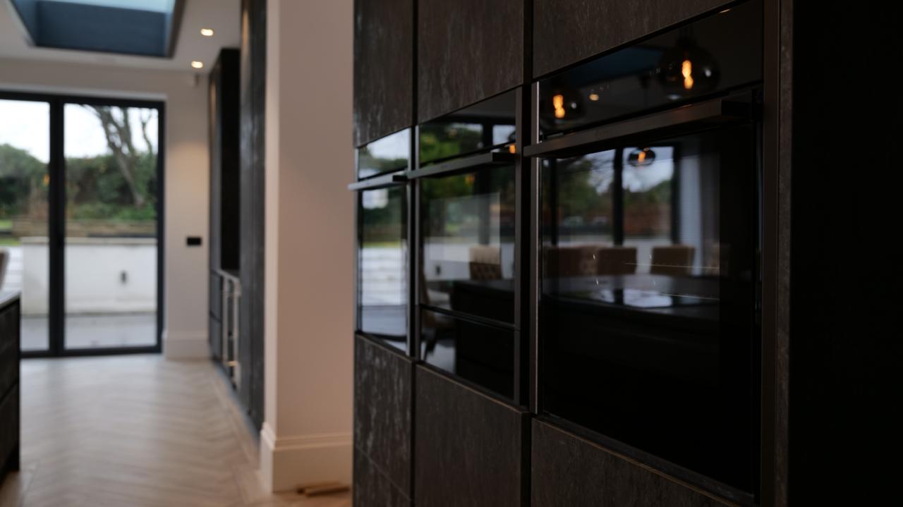 Modern fitted kitchen with island unit photographed for Thomas Howie Kitchens and Bedrooms in Southport.