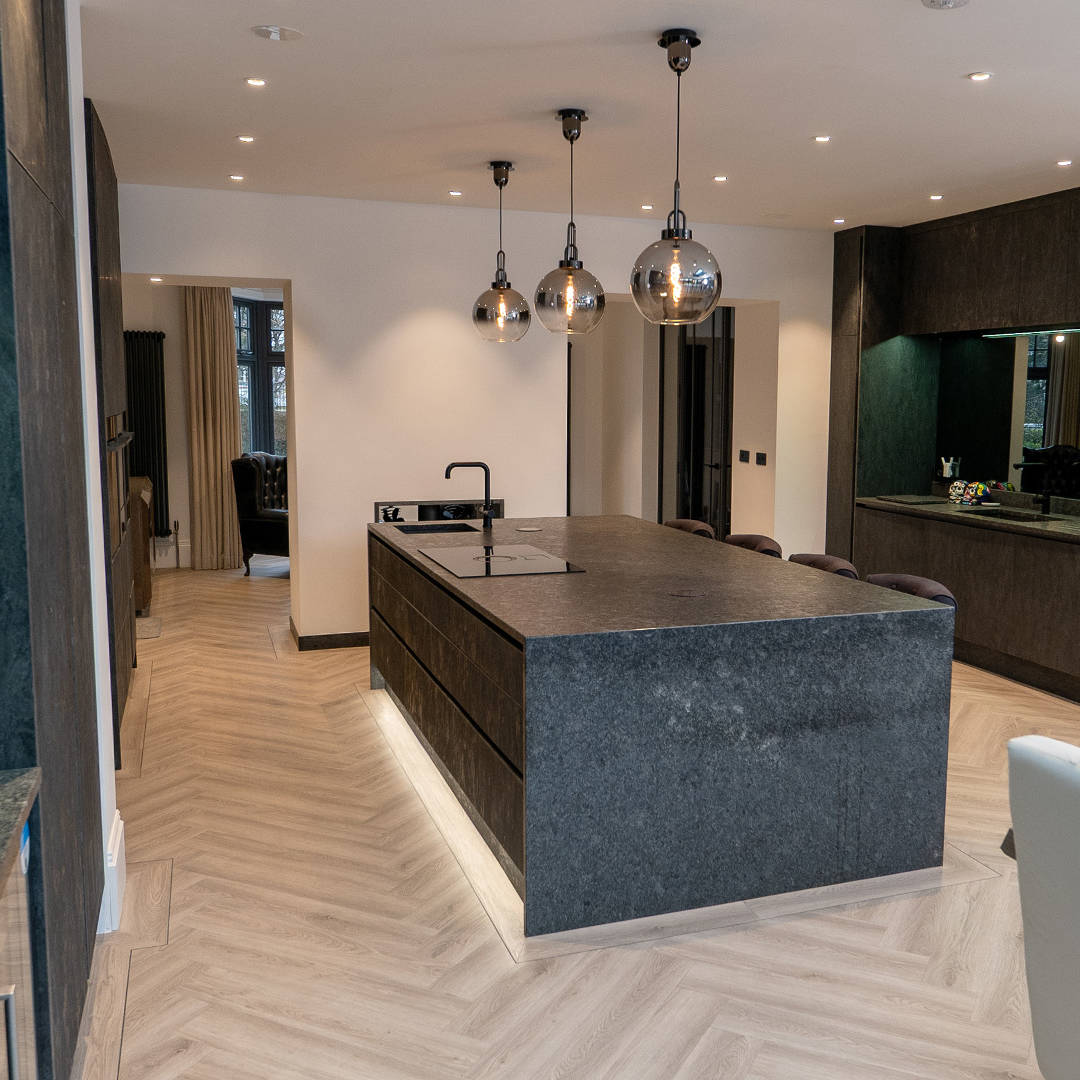 Close-up photography of kitchen island, cabinetry and worktop details in Southport home.