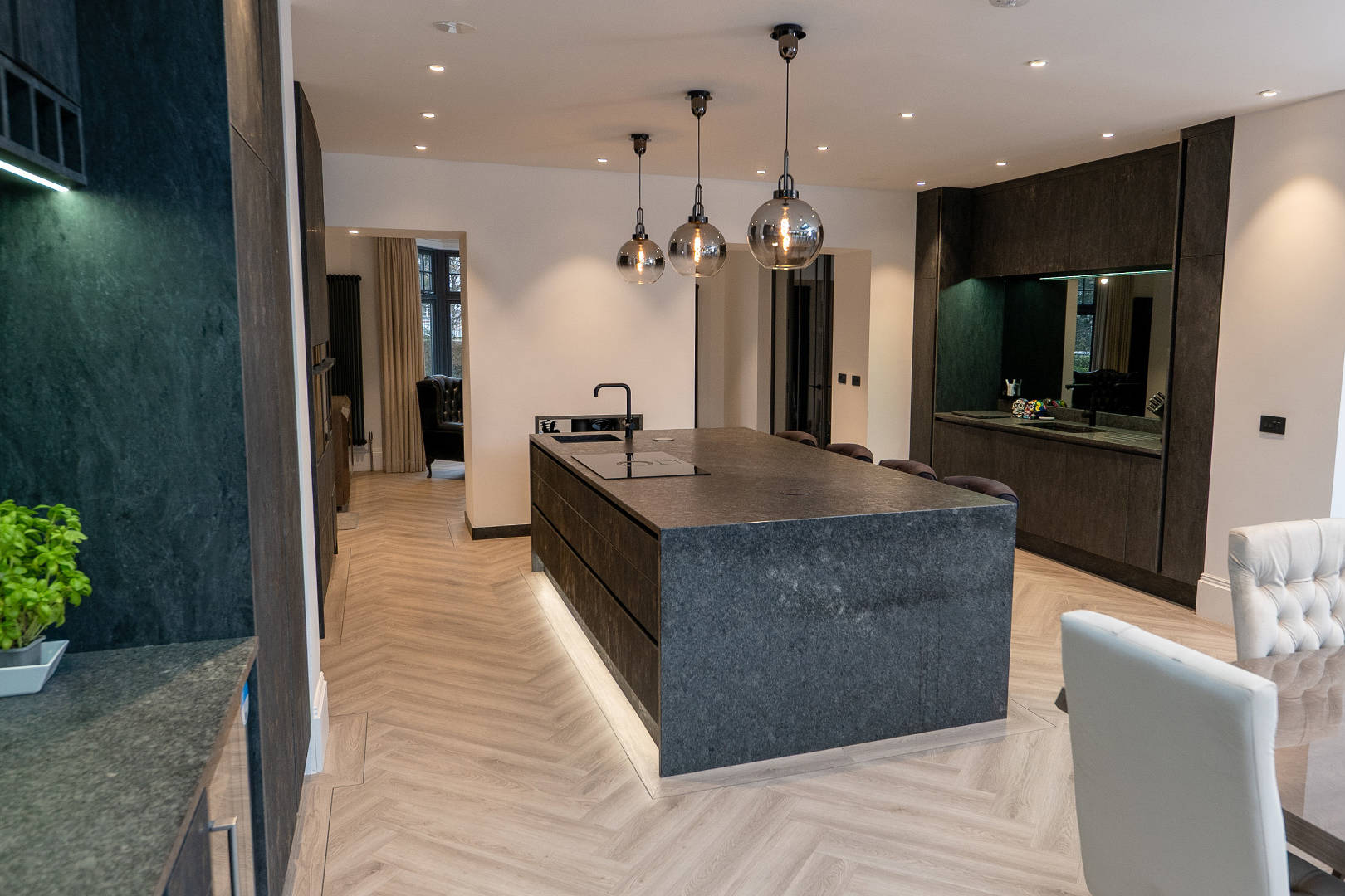 Close-up photography of kitchen island, cabinetry and worktop details in Southport home.