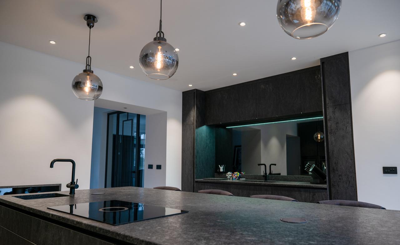 Modern fitted kitchen with island unit photographed for Thomas Howie Kitchens and Bedrooms in Southport.