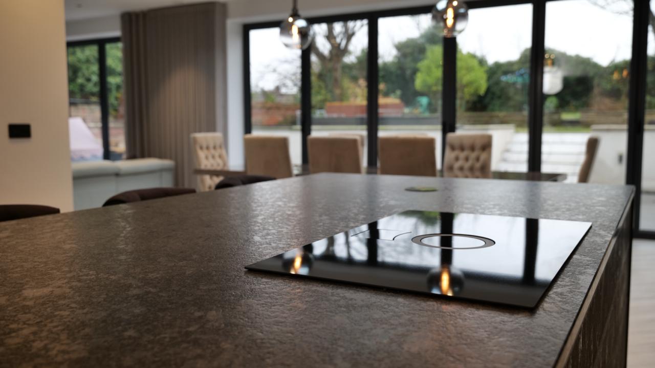 Close-up content and photography of kitchen island, cabinetry and worktop details in Southport home.