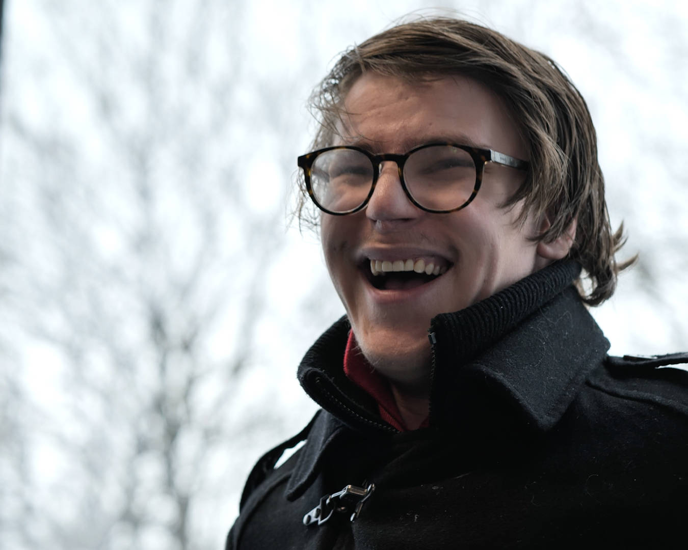 A student from Burlington House Sixth Form smiling during his interview for the documentary style video
