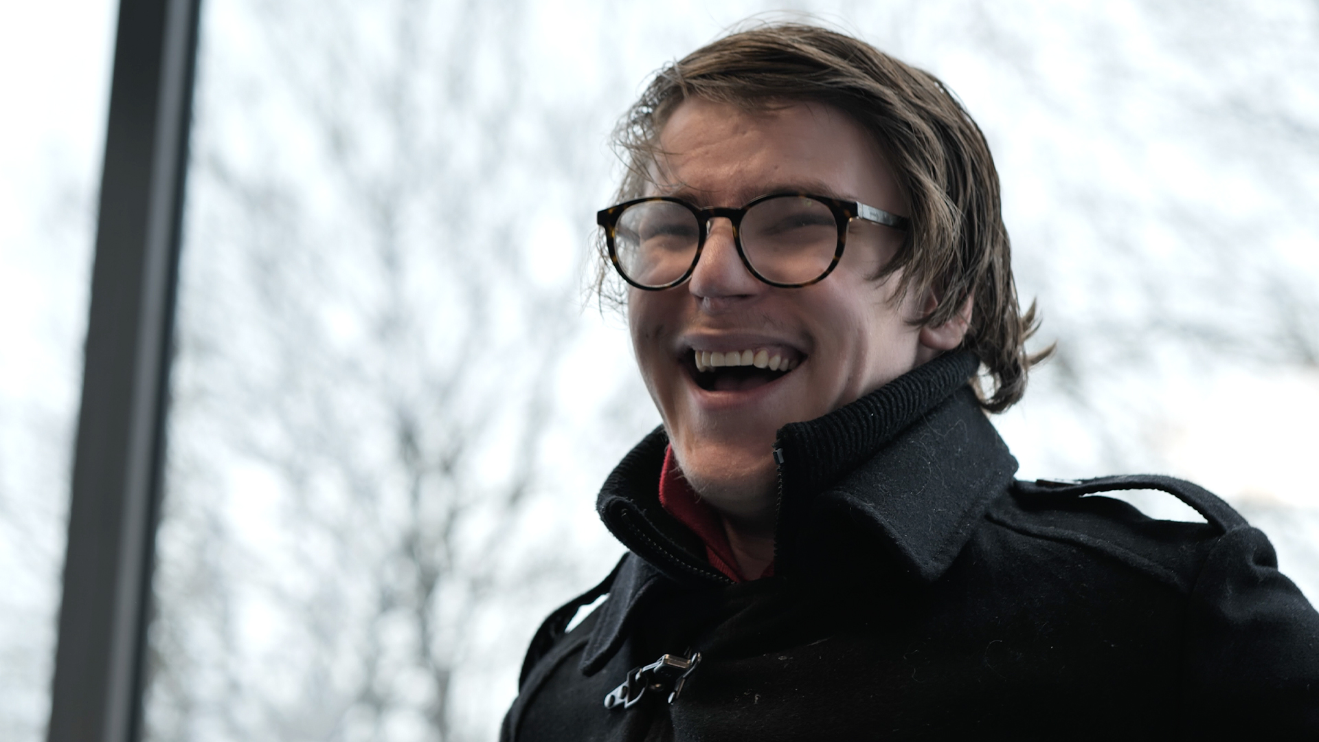 A student from Burlington House Sixth Form smiling during his interview for the documentary style video