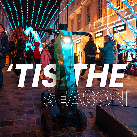 A photograph of a scooter in London with some modern typography