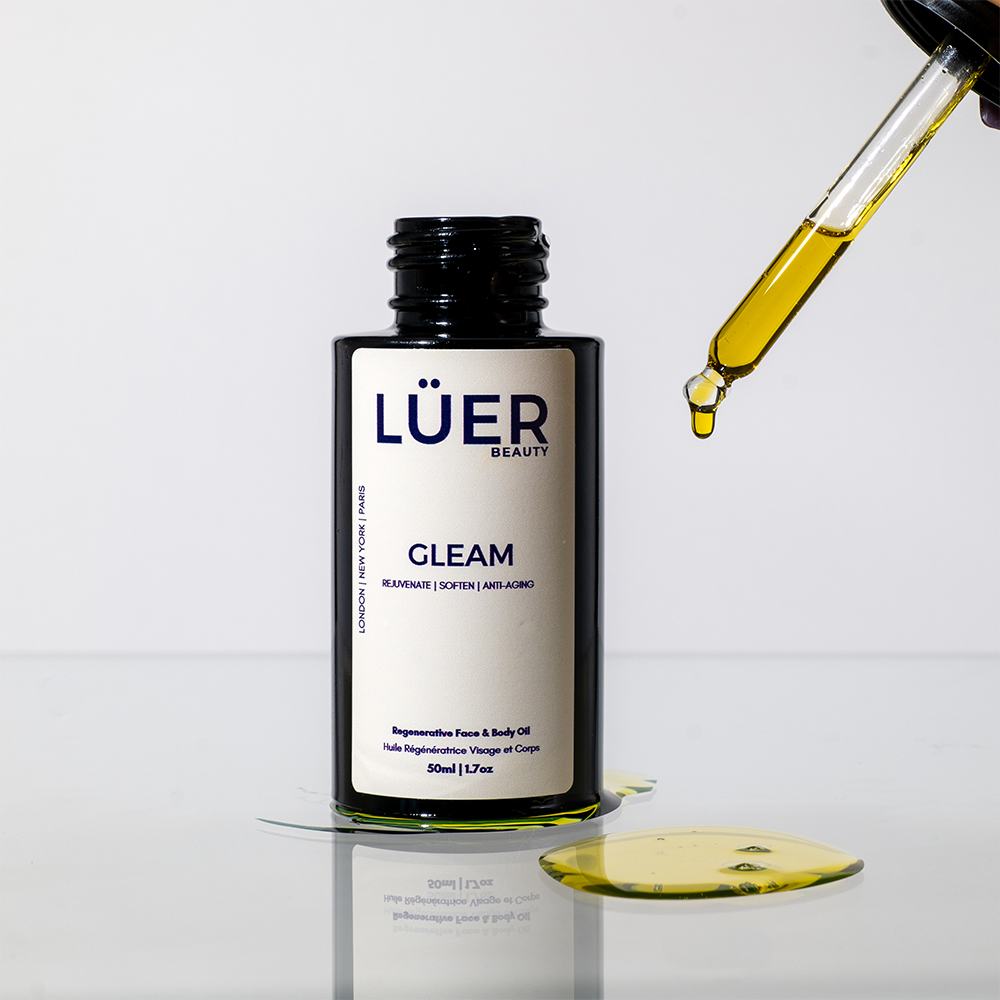 Close-up cosmetic cream texture and open skincare jar photographed for beauty campaign