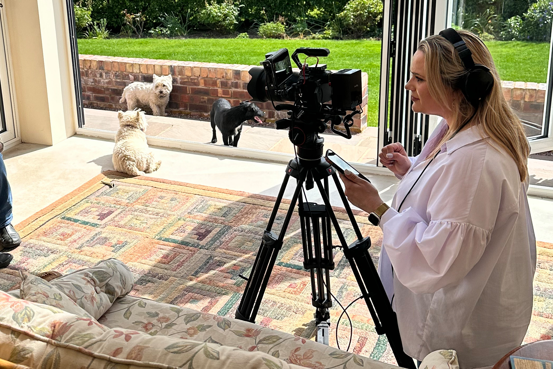 Professional videographer Rachel Airey filming a case study video series in Cheshire.