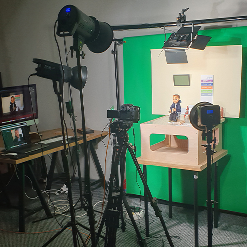 Stop motion puppet character inside accessible healthcare environment during animation production.