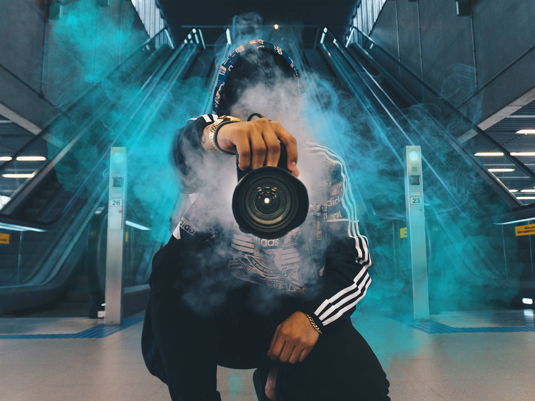 An image of a photographer surrounded by smoke used as part of a sales deck design created by Surfr Media.