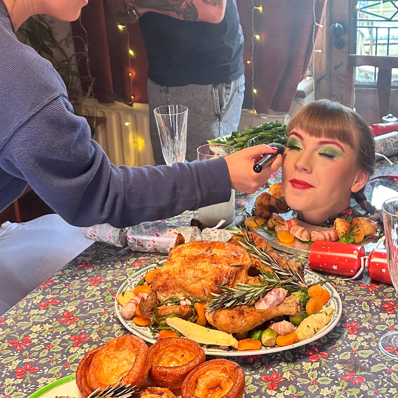 Behind the scenes filming a Christmas dinner scene for the 'Win Christmas' commercial