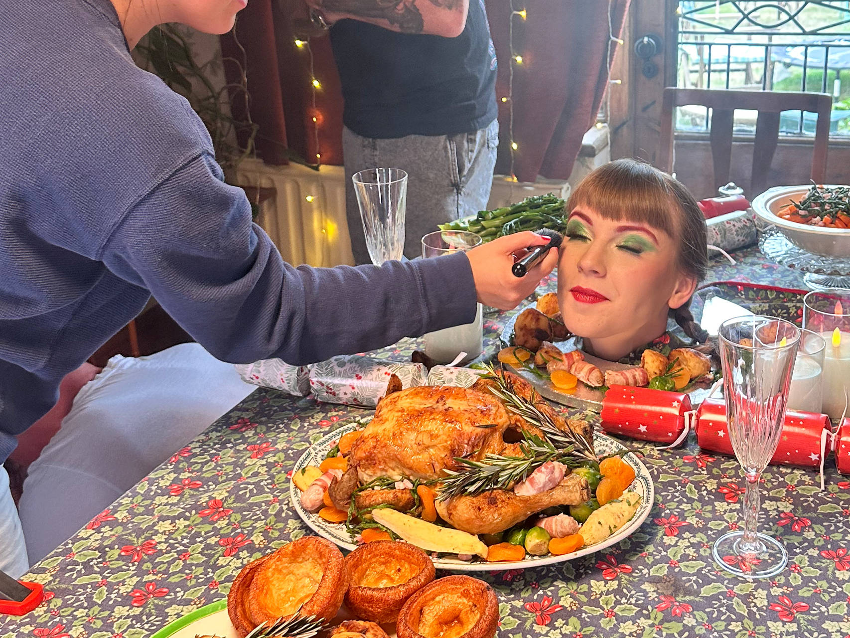 Behind the scenes filming a Christmas dinner scene for the 'Win Christmas' commercial