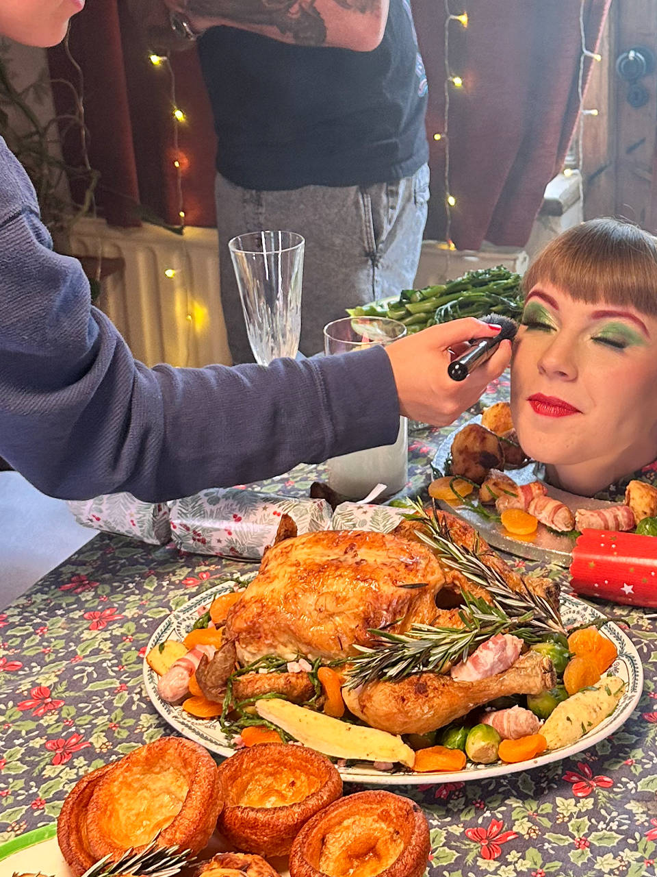 Behind the scenes filming a Christmas dinner scene for the 'Win Christmas' commercial