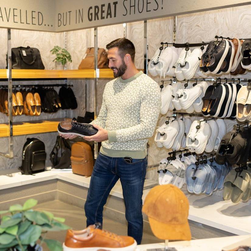 A model shopping inside River Island at Eagles Meadow Shopping Centre Wrexham.