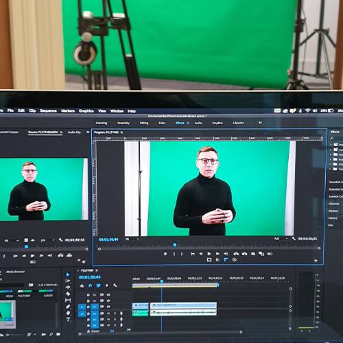 An editing programme runs on a laptop on location at a video shoot for App content in Liverpool.