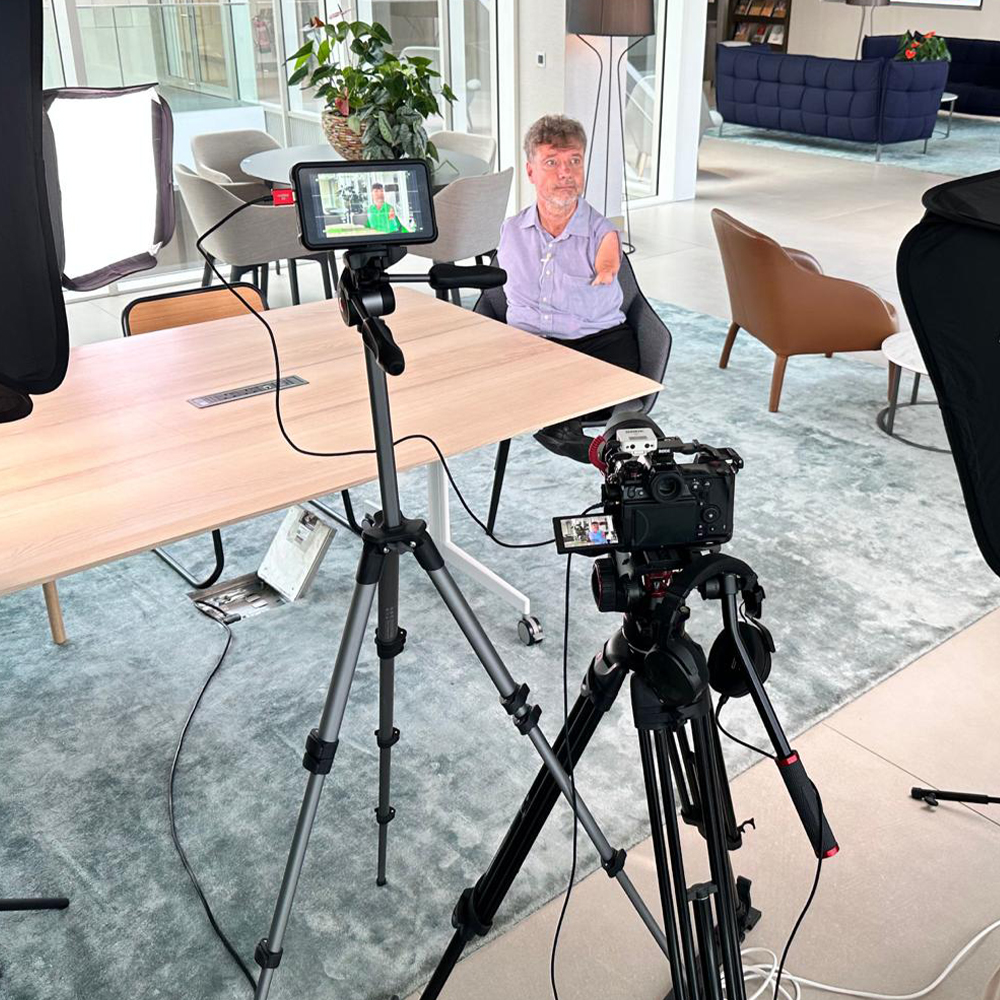 Mike Adams prepares for a piece to camera for a video production in London.