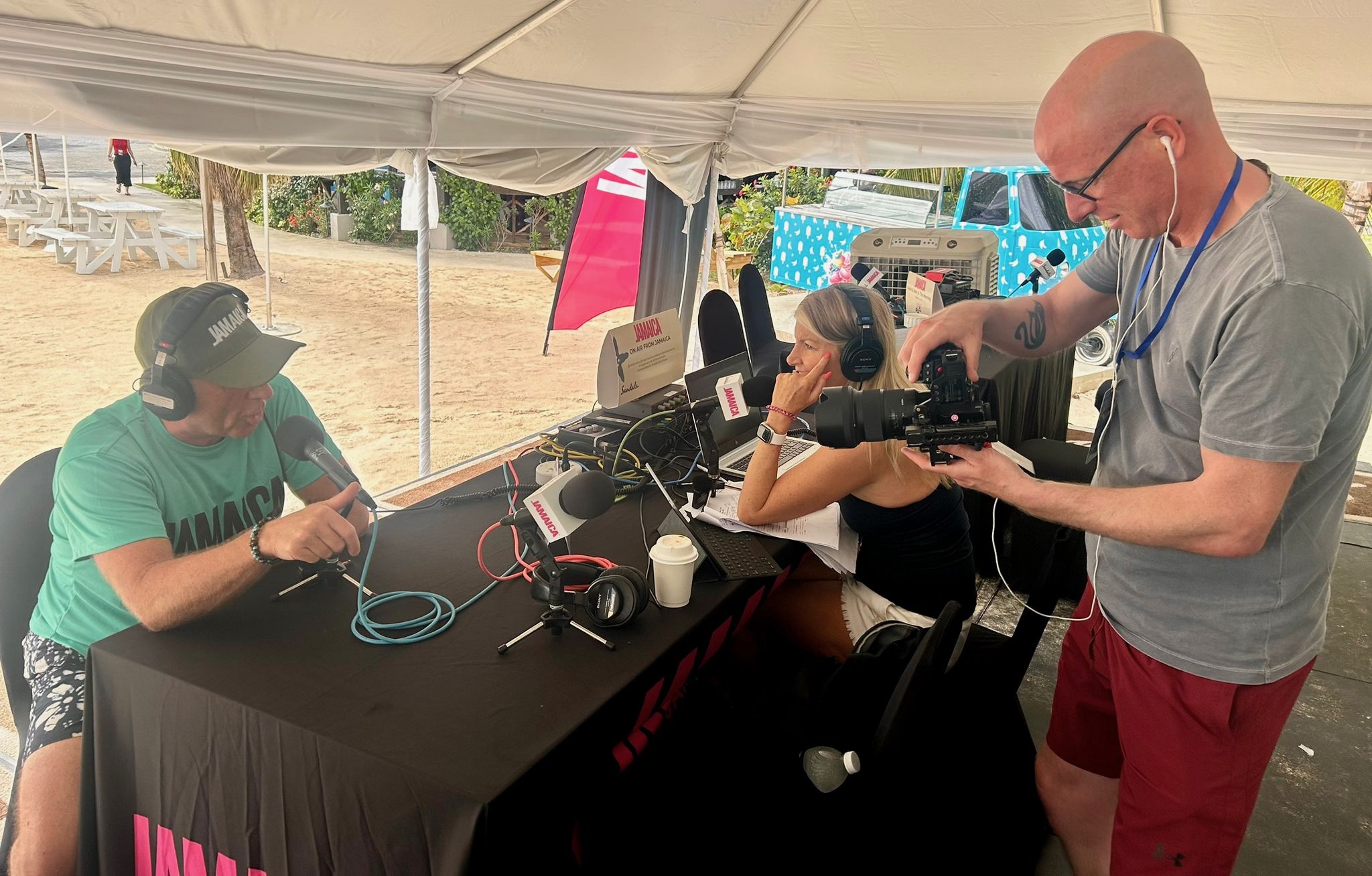 Southport videographer Matt Bell films UK presenter Neil Fox as he is interviewed in Jamaica.