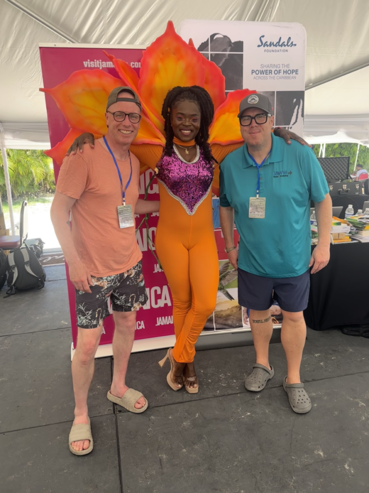 Southport videography and photography specialist Matt Bell poses with Liverpool presenter Baz Todd and a Jamaican carnival performer.