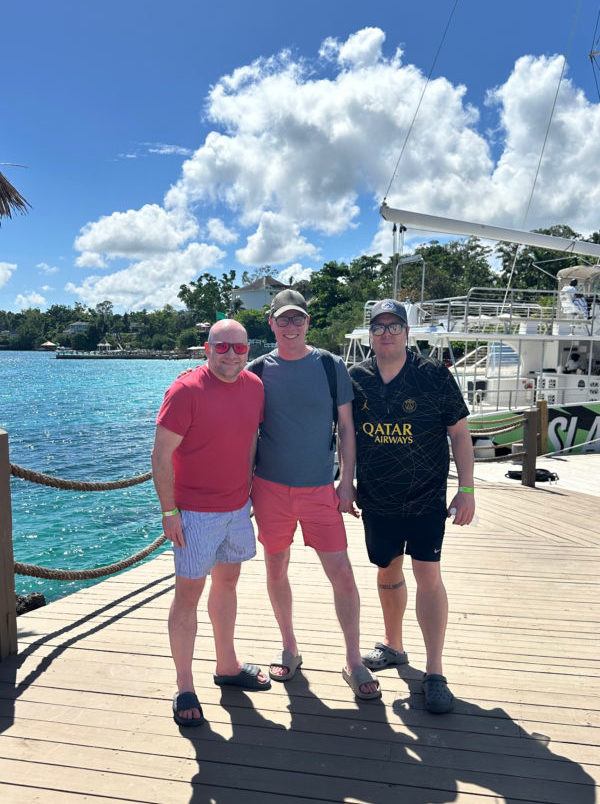 Liverpool presenters Scott Hughes and Baz Todd stood on a deck with content creator Matt Bell before they board a yacht on the Caribbean sea.